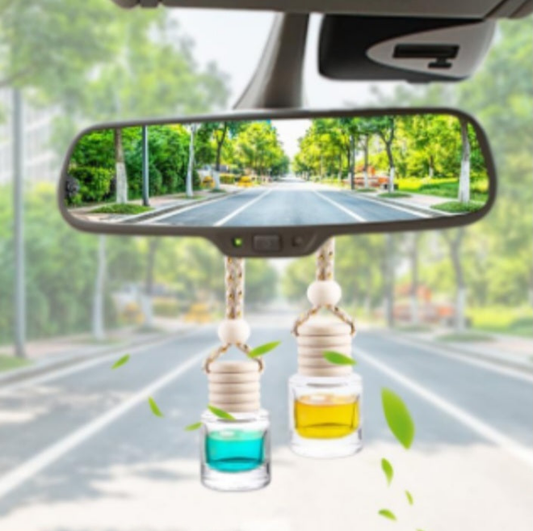 Handcrafted car freshener Bahamas scent hanging from the rearview mirror in a car