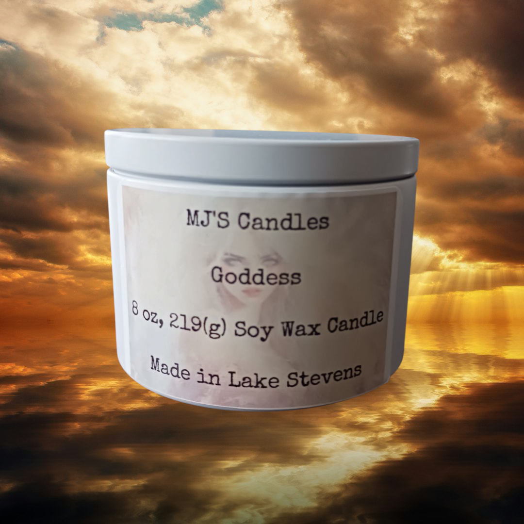 MJ'S Candles LLC 8oz handcrafted soy candle labeled Goddess against a dramatic sunset background