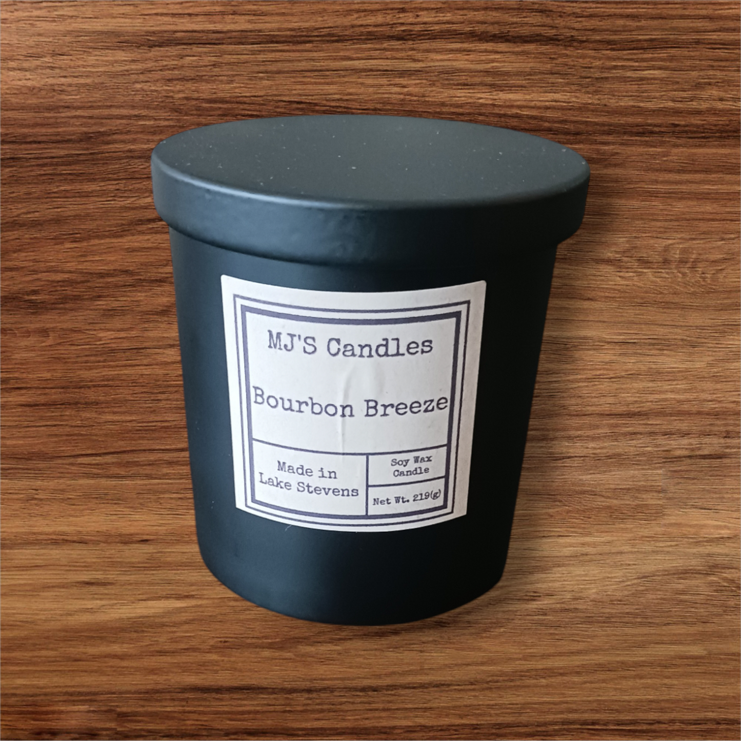 MJ'S Candles bourbon scented soy candle in black matte container with Bourbon Breeze label