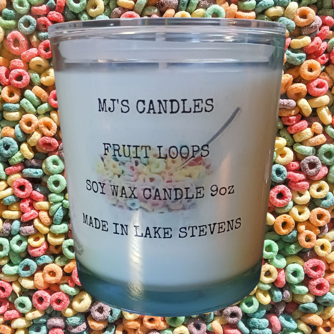 MJ'S CANDLES LLC handcrafted fruit loops candle in a clear glass jar with soy wax on a colorful fruit loops background