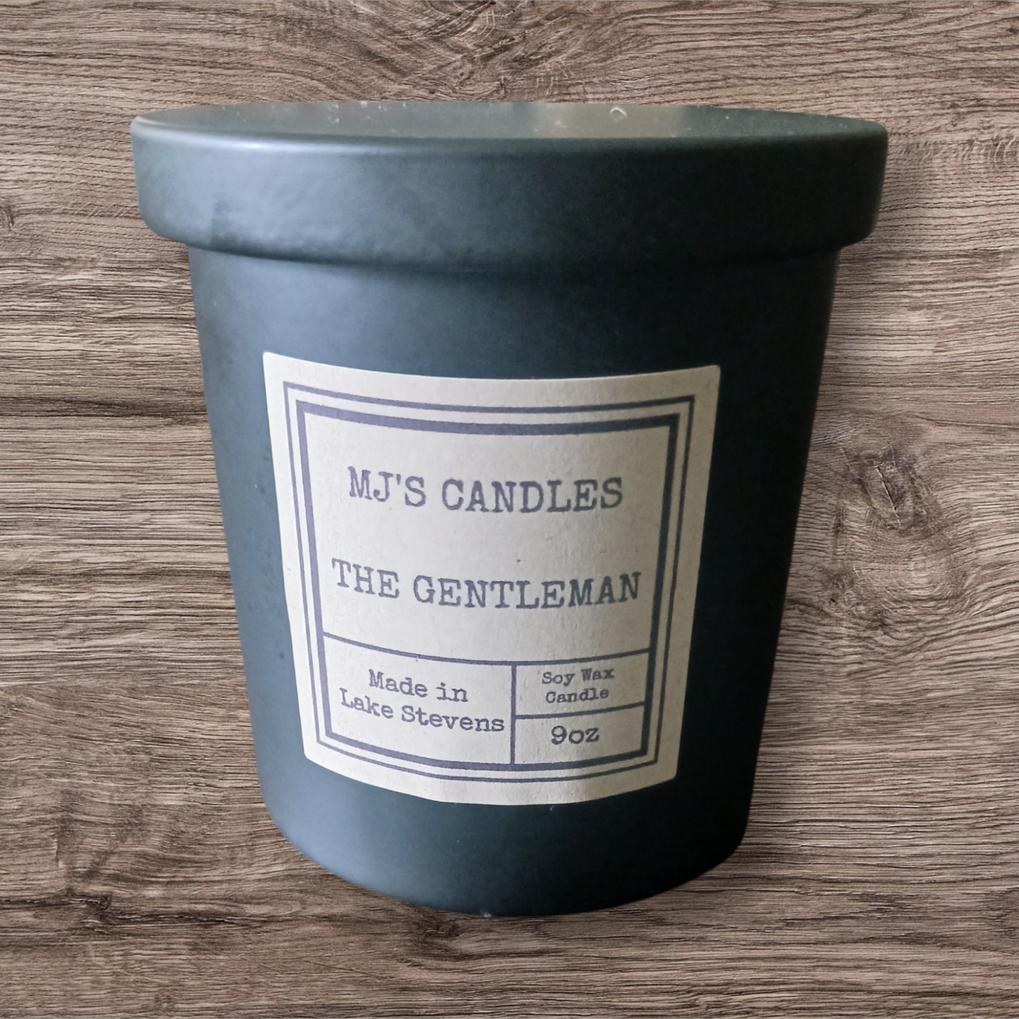 MJ'S CANDLES LLC handcrafted masculine soy candle in black container labeled The Gentleman 9oz