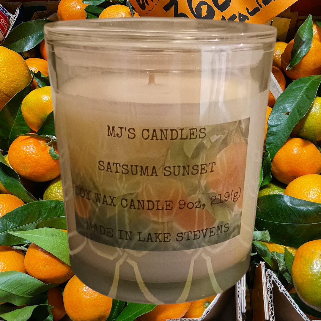 Handcrafted satsuma scented candle by MJ'S CANDLES LLC with natural soy wax in a clear glass jar