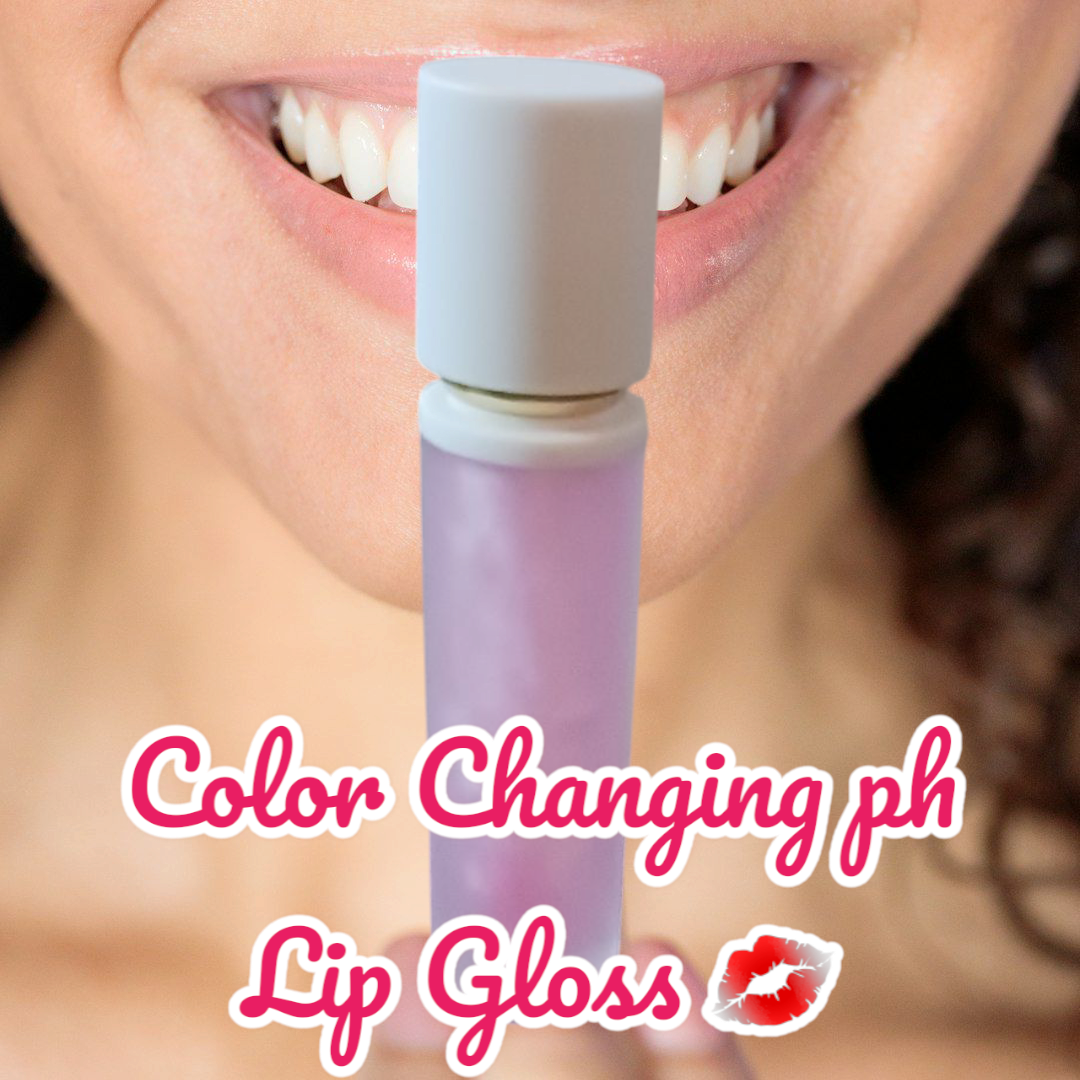 MJ'S CANDLES LLC all natural color changing lip gloss in a purple tube held near smiling lips