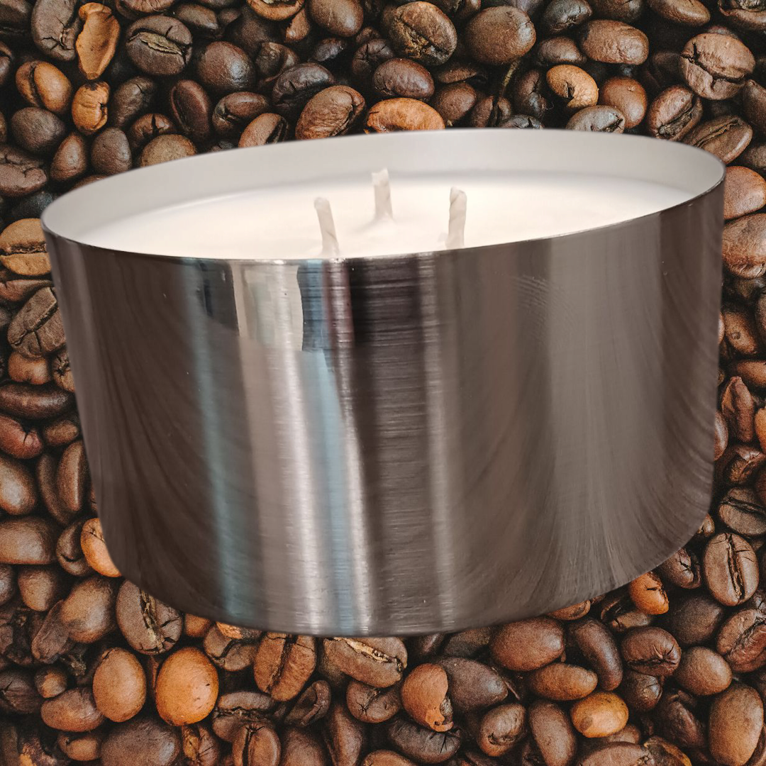MJ'S CANDLES LLC coffee scented soy candle in a silver metal container surrounded by coffee beans