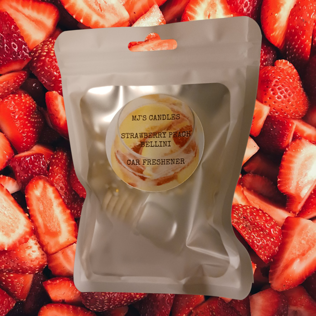 MJ'S CANDLES LLC strawberry peach bellini air freshener car in sealed silver pouch with sliced strawberries background