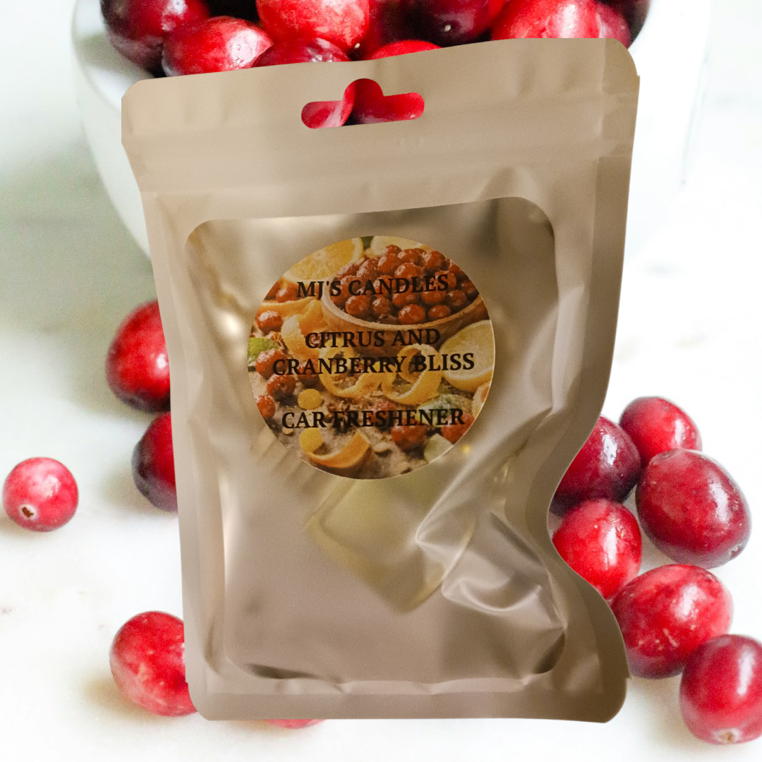 MJ'S CANDLES citrus and cranberry bliss air freshener in the car with resealable packaging
