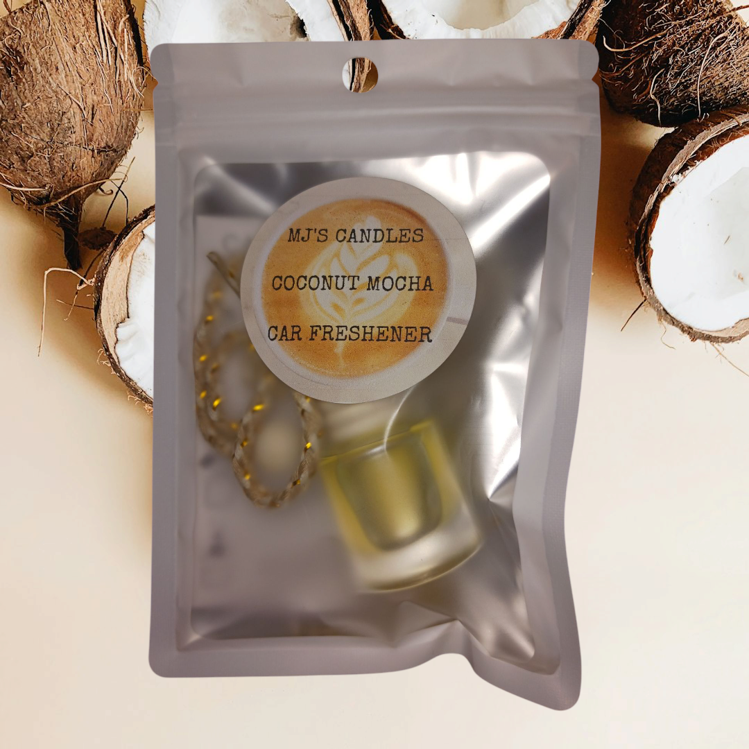 MJ'S CANDLES LLC coconut mocha car freshener in clear resealable packaging with coconut background