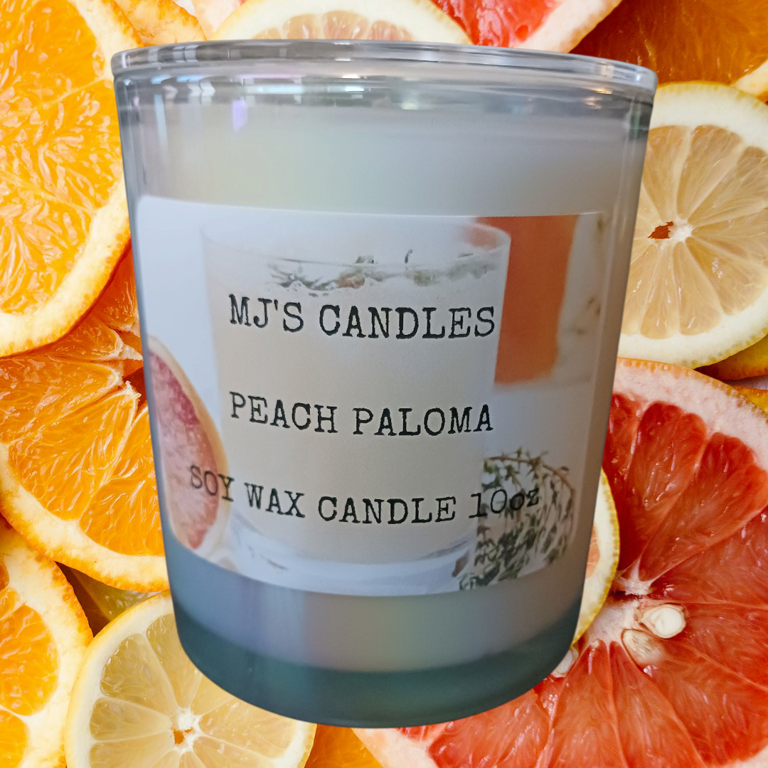 Handcrafted 10oz soy candle by MJ'S CANDLES LLC in Peach Paloma scent with citrus background