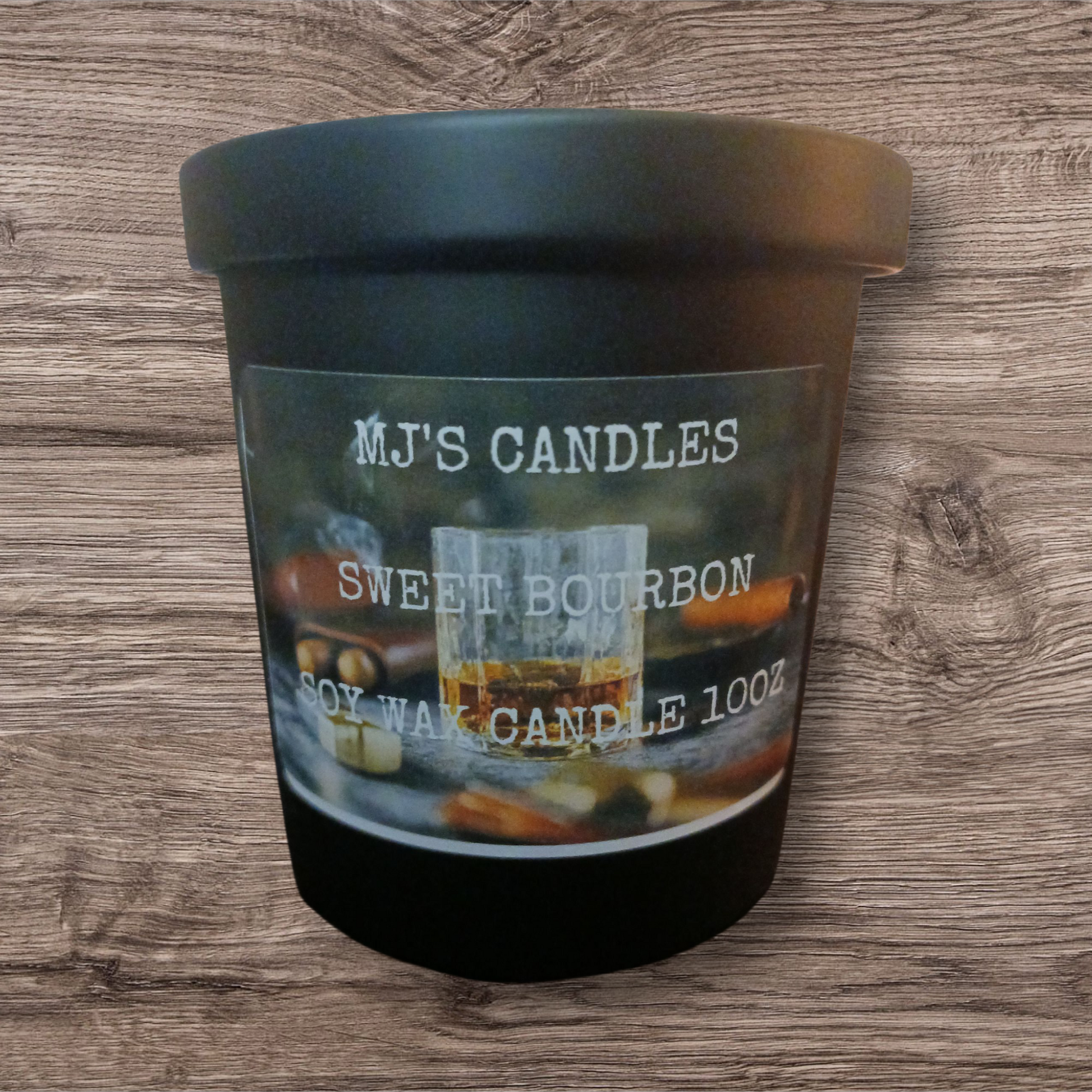 MJ'S CANDLES handcrafted luxury soy candle Sweet Bourbon scent in black jar on wooden background