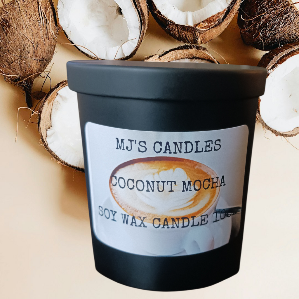 MJ'S CANDLES LLC handcrafted coconut coffee candle in black jar with coconut halves background