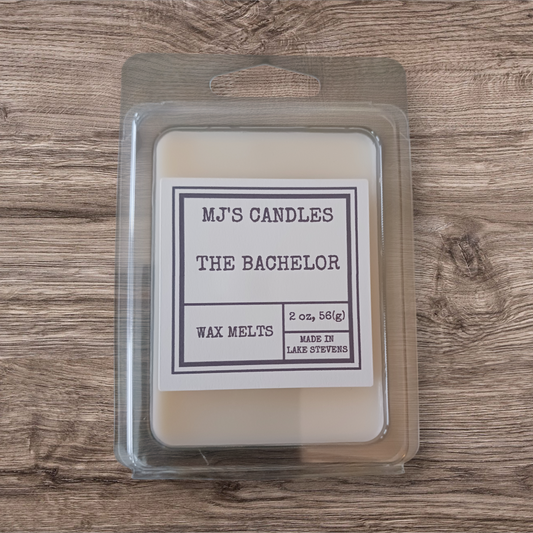 MJ'S CANDLES LLC all natural bachelor wax melts in white clamshell packaging on wooden surface