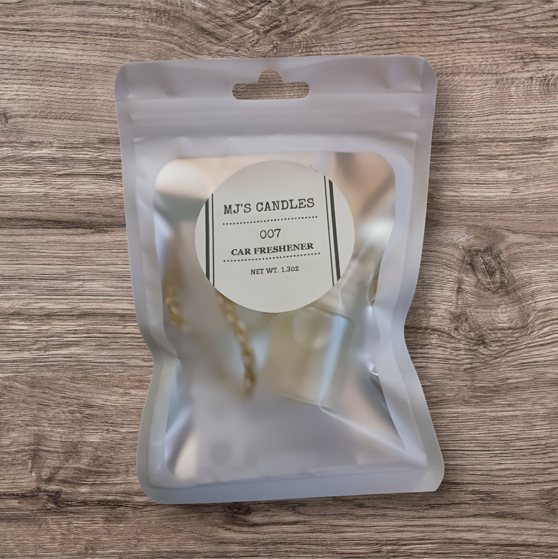 MJ'S CANDLES LLC luxury car freshener packaged in a frosted resealable pouch with label