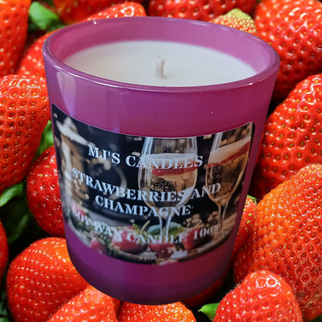 Luxury soy candle in a purple glass jar by MJ'S CANDLES LLC with strawberries and champagne scent