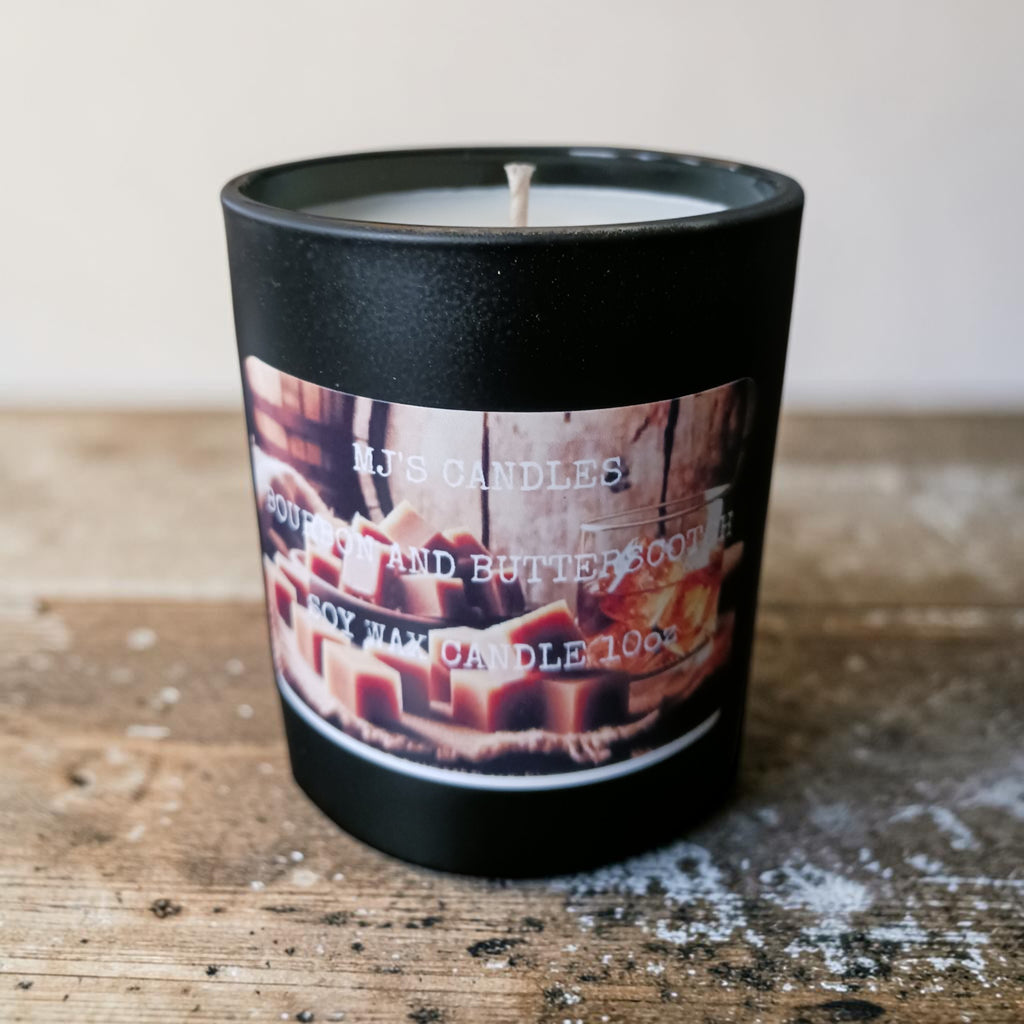 MJ'S CANDLES LLC soy candle wax in black container labeled Southern Butter Pecan scent