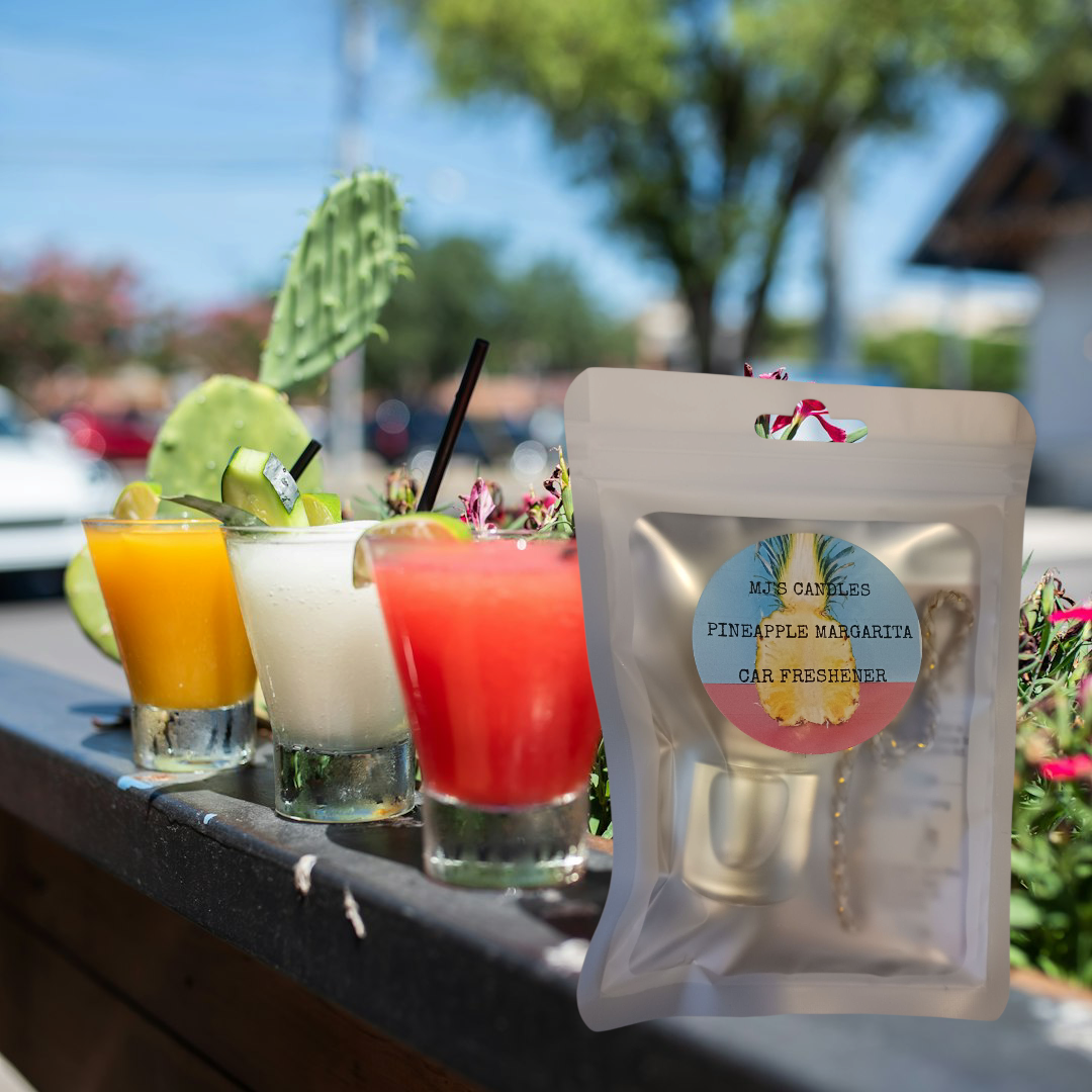 MJ'S CANDLES LLC pineapple margarita car freshener in resealable pouch with colorful drinks in background