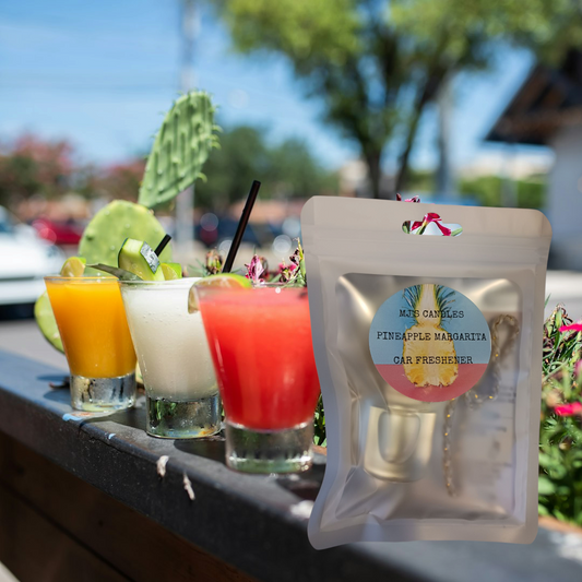 MJ'S CANDLES LLC pineapple margarita car freshener in resealable pouch with colorful drinks in background